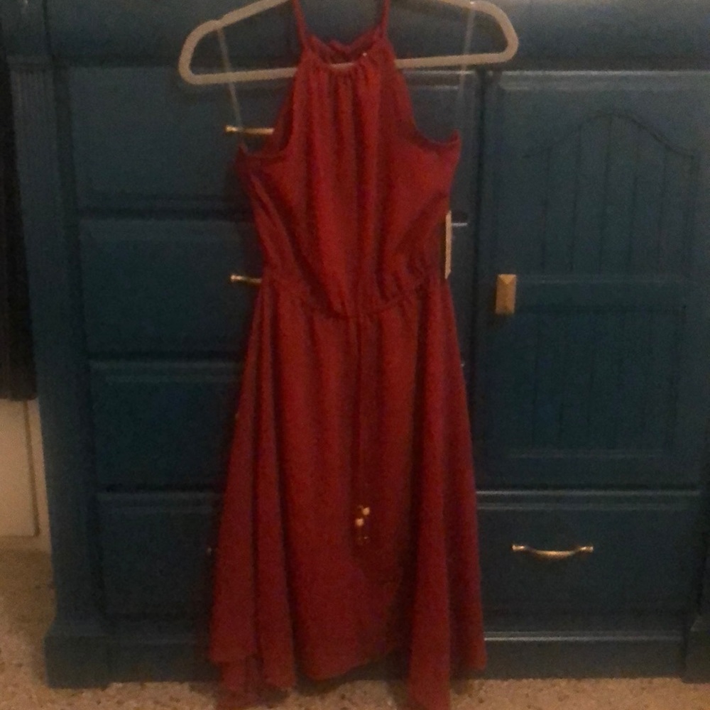 Burgundy mid length dress.